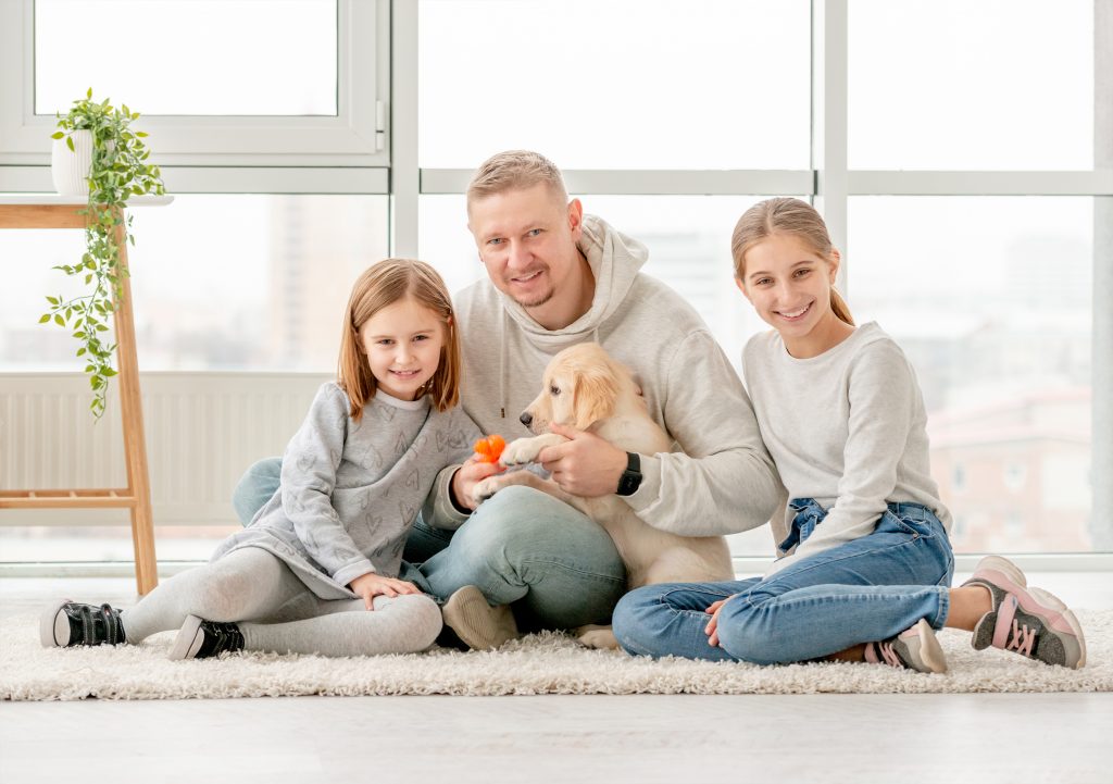 Happy family and puppy