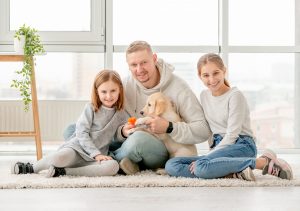 Happy family and puppy
